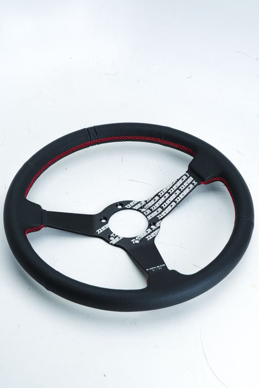 Three’s Racing Prisma Lab steering wheel by NRG